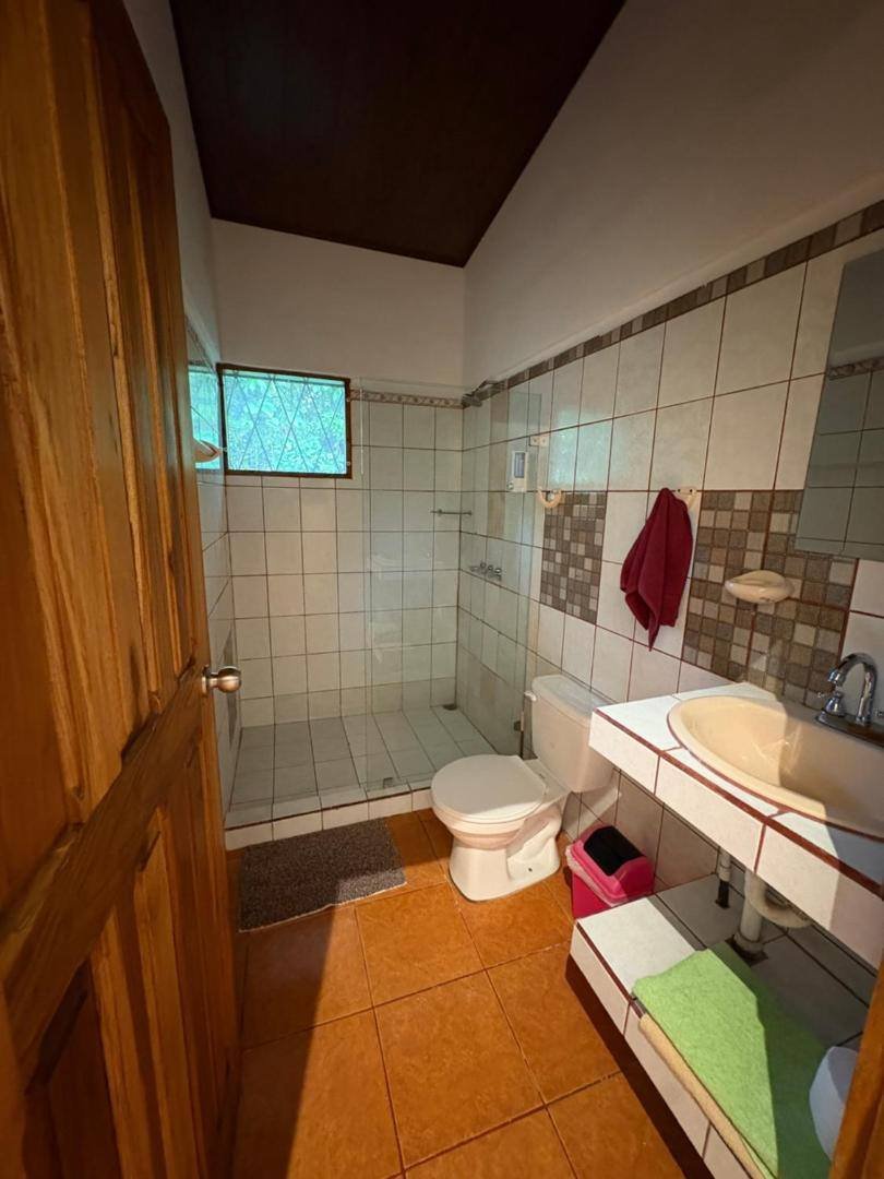 Private bathroom with toilet and sink